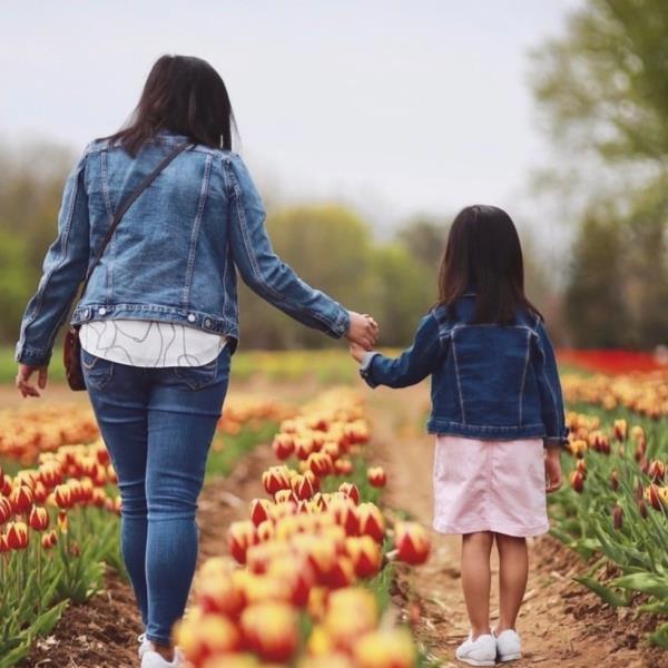Holding hands in the tulip farm